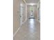 A bright foyer with tile flooring leads to various rooms in the home at 6645 Current Dr, Apollo Beach, FL 33572