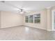 Spacious Gathering room with tile floors and large window at 6645 Current Dr, Apollo Beach, FL 33572