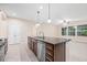 Kitchen island with stainless steel dishwasher and drawers at 6645 Current Dr, Apollo Beach, FL 33572