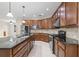 Spacious kitchen with dark wood cabinets and granite countertops at 6645 Current Dr, Apollo Beach, FL 33572