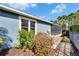 A neatly landscaped yard with colorful plantings complements the home's exterior at 6645 Current Dr, Apollo Beach, FL 33572