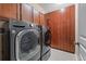 Laundry room with LG washer and dryer, and ample cabinet storage at 6645 Current Dr, Apollo Beach, FL 33572