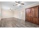 Living room with wood-look floors and built-in Murphy bed at 6645 Current Dr, Apollo Beach, FL 33572