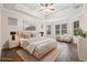 Virtually staged main bedroom with ample natural light at 6645 Current Dr, Apollo Beach, FL 33572