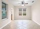 Bright room with tile floors and a ceiling fan at 6645 Current Dr, Apollo Beach, FL 33572