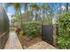 Landscaped side yard with gate access at 6645 Current Dr, Apollo Beach, FL 33572