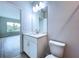 Bathroom with white vanity, toilet and access to bedroom at 7773 93Rd N St # 31, Seminole, FL 33777