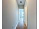 Bright hallway with wood-look flooring and access to rooms at 7773 93Rd N St # 31, Seminole, FL 33777