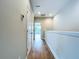 Bright hallway with wood flooring and access to bedroom at 7773 93Rd N St # 31, Seminole, FL 33777