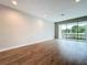 Bright living room with wood-look floors and sliding glass doors leading to a patio at 7773 93Rd N St # 31, Seminole, FL 33777