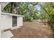 Large backyard with shed and mature trees at 803 E North St, Tampa, FL 33604