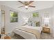 Main bedroom with a king-size bed, neutral decor, and ample natural light at 803 E North St, Tampa, FL 33604