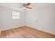 Simple bedroom with wood floors and ceiling fan at 803 E North St, Tampa, FL 33604