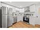 Updated kitchen featuring white shaker cabinets and stainless steel appliances at 803 E North St, Tampa, FL 33604