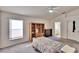 Well-lit bedroom with built-in shelving and an ensuite bath at 803 Innergary Pl, Valrico, FL 33594