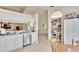 Kitchen with white cabinets, stainless steel appliances and a walk in pantry at 803 Innergary Pl, Valrico, FL 33594