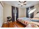 Bedroom with hardwood floors, a queen bed, and ceiling fan at 832 13Th N Ave, St Petersburg, FL 33701