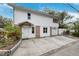 Two-story house with attached garage and landscaping at 832 13Th N Ave, St Petersburg, FL 33701