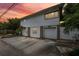 Two-story house with attached garage and driveway, at sunset at 832 13Th N Ave, St Petersburg, FL 33701