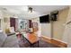 Living room with gray couch and wooden coffee table, view toward kitchen at 832 13Th N Ave, St Petersburg, FL 33701