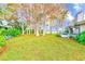 Backyard with lake access and lush landscaping at 90 S Highland Ave # 7, Tarpon Springs, FL 34689