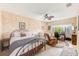 Large bedroom with a sitting area, built-in workspace and ceiling fan at 90 S Highland Ave # 7, Tarpon Springs, FL 34689