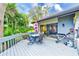 Spacious deck with lake view, patio furniture, and grill at 90 S Highland Ave # 7, Tarpon Springs, FL 34689