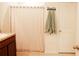 Bathroom with shower and linen storage at 10029 Warm Stone St, Thonotosassa, FL 33592