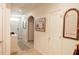 Home entryway with decorative wall art and a small table at 10029 Warm Stone St, Thonotosassa, FL 33592