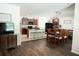 Open concept kitchen and dining area with dark wood cabinets at 10029 Warm Stone St, Thonotosassa, FL 33592