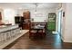 Open kitchen and dining area with dark wood cabinets at 10029 Warm Stone St, Thonotosassa, FL 33592