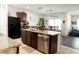 Kitchen island with granite countertop and stainless steel dishwasher at 10029 Warm Stone St, Thonotosassa, FL 33592