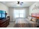 Spacious main bedroom with large window and TV at 10029 Warm Stone St, Thonotosassa, FL 33592