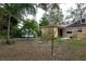 Backyard view with shed and additional landscaping at 1018 E Hanna Ave, Tampa, FL 33604