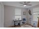 Bright bedroom with wood flooring, window blinds, and ceiling fan at 1018 E Hanna Ave, Tampa, FL 33604