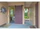 View of backyard access with barn door entry to laundry area at 1018 E Hanna Ave, Tampa, FL 33604