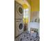 Stackable washer and dryer in bright laundry room with utility sink at 1018 E Hanna Ave, Tampa, FL 33604