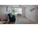 Living room featuring teal armchairs and a ceiling fan at 1018 E Hanna Ave, Tampa, FL 33604