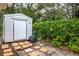 Metal storage shed with paved pathway at 1018 E Hanna Ave, Tampa, FL 33604