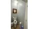 Small half bathroom with toilet and sink at 10537 Sky Flower Ct, Land O Lakes, FL 34638