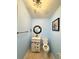 Clean bathroom, featuring a white vanity, octagon mirror, and light blue walls at 10537 Sky Flower Ct, Land O Lakes, FL 34638