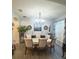 Elegant dining room with oval table and chandelier at 10537 Sky Flower Ct, Land O Lakes, FL 34638