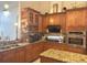 Well-equipped kitchen with granite countertops and wooden cabinets at 10537 Sky Flower Ct, Land O Lakes, FL 34638