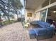 Outdoor patio with lake view, seating, and pavers at 10537 Sky Flower Ct, Land O Lakes, FL 34638