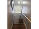 Modern staircase with light-colored carpeting and a charming window at 10537 Sky Flower Ct, Land O Lakes, FL 34638