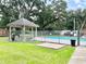 Community pool with gazebo and seating at 10538 Bay Hills Cir, Thonotosassa, FL 33592