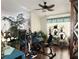 Home exercise area with recumbent bike, stepper, and various plants at 10538 Bay Hills Cir, Thonotosassa, FL 33592