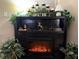 Electric fireplace with decorative mantel and candle holders at 10538 Bay Hills Cir, Thonotosassa, FL 33592