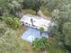 Aerial view showing house, pool, and large yard at 1080 Buena Vista Ave, Brooksville, FL 34601