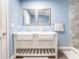 Bathroom featuring a double vanity and light blue walls at 1080 Buena Vista Ave, Brooksville, FL 34601